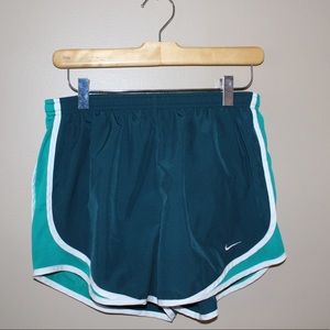 Blue and turquoise Nike running shorts.